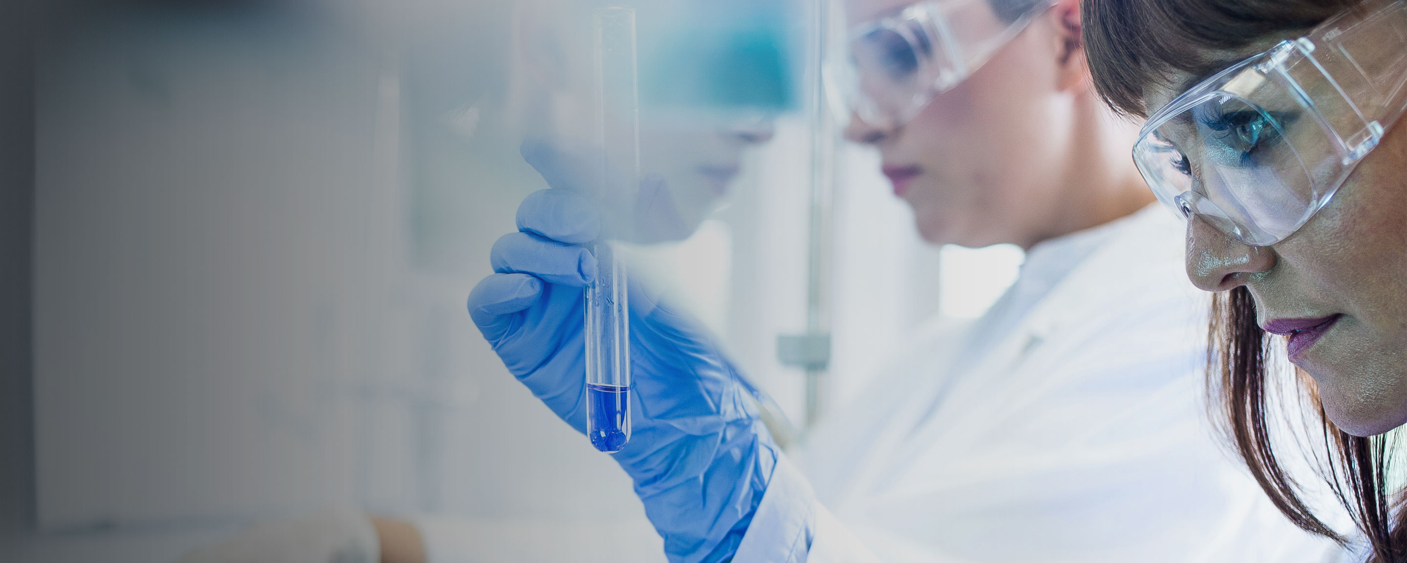 Woman in lab using solvents